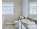 Bathroom features a white sink, granite countertops, and a bright window at 4889 Hidden Creek Pl, Decatur, GA 30035