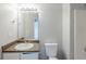 Modest bathroom design with a sink, toilet, and shower, showcasing clean and simple fixtures at 4889 Hidden Creek Pl, Decatur, GA 30035