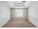 Neutral toned bedroom with carpet, overhead ceiling fan and natural light at 4889 Hidden Creek Pl, Decatur, GA 30035