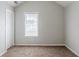 Clean bedroom with natural light, neutral carpet, and a closet, perfect for relaxation at 4889 Hidden Creek Pl, Decatur, GA 30035