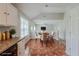 Cozy dining area features a round table, four chairs, and natural light from a nearby window at 4889 Hidden Creek Pl, Decatur, GA 30035