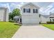 Charming two-story home featuring a two-car garage and well-maintained front yard at 4889 Hidden Creek Pl, Decatur, GA 30035