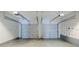 Spacious two car garage with metal doors and electric openers at 4889 Hidden Creek Pl, Decatur, GA 30035