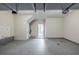 Spacious garage with painted walls, concrete flooring and doorway to interior at 4889 Hidden Creek Pl, Decatur, GA 30035