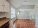 Open kitchen area with white cabinets, modern appliances, and adjacent dining space at 4889 Hidden Creek Pl, Decatur, GA 30035