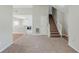 Spacious living room with fireplace, carpet, and staircase to the upper level at 4889 Hidden Creek Pl, Decatur, GA 30035