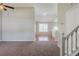 Inviting living room with neutral carpet, bright window, and an open floor plan at 4889 Hidden Creek Pl, Decatur, GA 30035