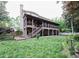 Expansive backyard featuring a large screened porch, patio, and lush green lawn at 1425 Turtle Dove Ln, Lawrenceville, GA 30043