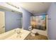 Bathroom with a shower-tub combo, and a light-colored vanity at 1425 Turtle Dove Ln, Lawrenceville, GA 30043