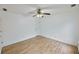 Bright, empty bedroom with hard wood floors and a ceiling fan at 1425 Turtle Dove Ln, Lawrenceville, GA 30043