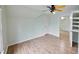 Bright bedroom featuring light-colored walls, wood floors, and a unique ceiling fan at 1425 Turtle Dove Ln, Lawrenceville, GA 30043