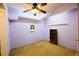 Bedroom with neutral carpet, closet, and a ceiling fan at 1425 Turtle Dove Ln, Lawrenceville, GA 30043