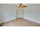 This bedroom features wood laminate flooring, neutral paint, and a ceiling fan at 1425 Turtle Dove Ln, Lawrenceville, GA 30043