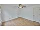 This bedroom features wood laminate flooring and neutral paint at 1425 Turtle Dove Ln, Lawrenceville, GA 30043