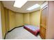 Small bedroom featuring a bed with a colorful quilt and a wooden door at 1425 Turtle Dove Ln, Lawrenceville, GA 30043