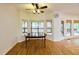 Cozy breakfast nook with a large bay window, hardwood floors, and seamless outdoor deck access at 1425 Turtle Dove Ln, Lawrenceville, GA 30043