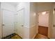 Hallway with hardwood floors, storage, and access to rooms at 1425 Turtle Dove Ln, Lawrenceville, GA 30043