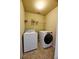 A laundry room with washer and dryer at 1425 Turtle Dove Ln, Lawrenceville, GA 30043