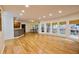 Open concept living room featuring hardwood floors, recessed lighting, and a seamless connection to the outdoor deck at 1425 Turtle Dove Ln, Lawrenceville, GA 30043
