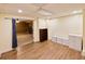 Cozy living room featuring modern laminate flooring and lots of storage at 1425 Turtle Dove Ln, Lawrenceville, GA 30043