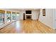 Bright open concept living room with hardwood floors, fireplace, and grand father clock at 1425 Turtle Dove Ln, Lawrenceville, GA 30043