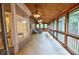 Spacious screened-in porch featuring multiple ceiling fans and ample seating at 1425 Turtle Dove Ln, Lawrenceville, GA 30043