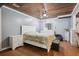Bedroom with hardwood style floors, natural light, a ceiling fan and light grey walls at 144 Boones Ridge Se Pkwy, Acworth, GA 30102