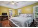 Spacious bedroom with vaulted ceilings, fireplace, and large windows allowing ample natural light at 144 Boones Ridge Se Pkwy, Acworth, GA 30102