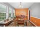Inviting dining room featuring large windows, natural light, hardwood floors, and stylish decor at 144 Boones Ridge Se Pkwy, Acworth, GA 30102