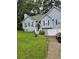 Charming two-story home with a well-manicured lawn, attached garage and a welcoming front entrance at 144 Boones Ridge Se Pkwy, Acworth, GA 30102