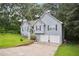 Attractive two-story home featuring a two-car garage and a well-maintained lawn with mature landscaping at 144 Boones Ridge Se Pkwy, Acworth, GA 30102