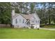 Inviting two-story home with well-kept lawn, mature trees, and a driveway leading to an attached two-car garage at 144 Boones Ridge Se Pkwy, Acworth, GA 30102
