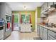 Bright kitchen with stainless steel appliances, granite countertops, and access to the backyard deck at 144 Boones Ridge Se Pkwy, Acworth, GA 30102