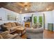 Cozy living room with a fireplace, plush seating, hardwood floors, and plenty of natural light at 144 Boones Ridge Se Pkwy, Acworth, GA 30102