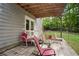 Outdoor patio with seating offers a relaxing space with lush greenery and a home exterior view at 144 Boones Ridge Se Pkwy, Acworth, GA 30102