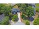 Aerial view of a charming two-story blue home with a well-manicured front yard and a private driveway at 1930 Huntcliff Dr, Lawrenceville, GA 30043