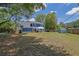Spacious backyard with mature trees, gazebo, and storage shed at 1930 Huntcliff Dr, Lawrenceville, GA 30043