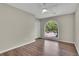 Cozy bedroom with wood floors, a ceiling fan, and arched window view at 1930 Huntcliff Dr, Lawrenceville, GA 30043