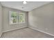 Bright bedroom with two windows and neutral carpet at 1930 Huntcliff Dr, Lawrenceville, GA 30043