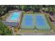 Aerial view of community pool with lounge chairs and tennis courts, offering recreational opportunities at 1930 Huntcliff Dr, Lawrenceville, GA 30043