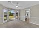 Dining area with bay window, view of back yard and modern ceiling fan at 1930 Huntcliff Dr, Lawrenceville, GA 30043