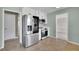 Updated kitchen with stainless steel refrigerator, microwave, and stove/oven at 1930 Huntcliff Dr, Lawrenceville, GA 30043