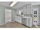 Bright kitchen features updated cabinets, stainless steel appliances, and access to back yard at 1930 Huntcliff Dr, Lawrenceville, GA 30043