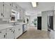 Bright kitchen featuring stainless steel appliances, white cabinetry, and breakfast nook at 1930 Huntcliff Dr, Lawrenceville, GA 30043
