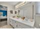 Spacious bathroom with double vanity, a large mirror, and ample lighting at 1930 Huntcliff Dr, Lawrenceville, GA 30043