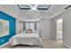 Large bedroom with decorative ceiling fan, plush carpet, and ensuite bathroom access at 1930 Huntcliff Dr, Lawrenceville, GA 30043