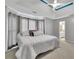 Spacious main bedroom with a ceiling fan, ensuite bathroom, and plush carpet at 1930 Huntcliff Dr, Lawrenceville, GA 30043