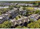 An aerial view showcasing a modern townhome community nestled among lush greenery at 2172 Peach Se Ln, Smyrna, GA 30080