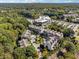 Aerial view showcasing the luxurious townhome community, surrounded by trees and parking at 2172 Peach Se Ln, Smyrna, GA 30080