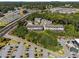 A beautiful aerial view of townhomes surrounded by greenery and parking at 2172 Peach Se Ln, Smyrna, GA 30080
